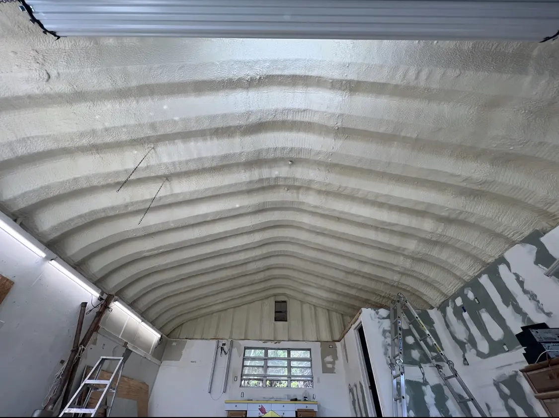 Spray polyurethane foam applied to the underside of a metal roof deck in Somerton