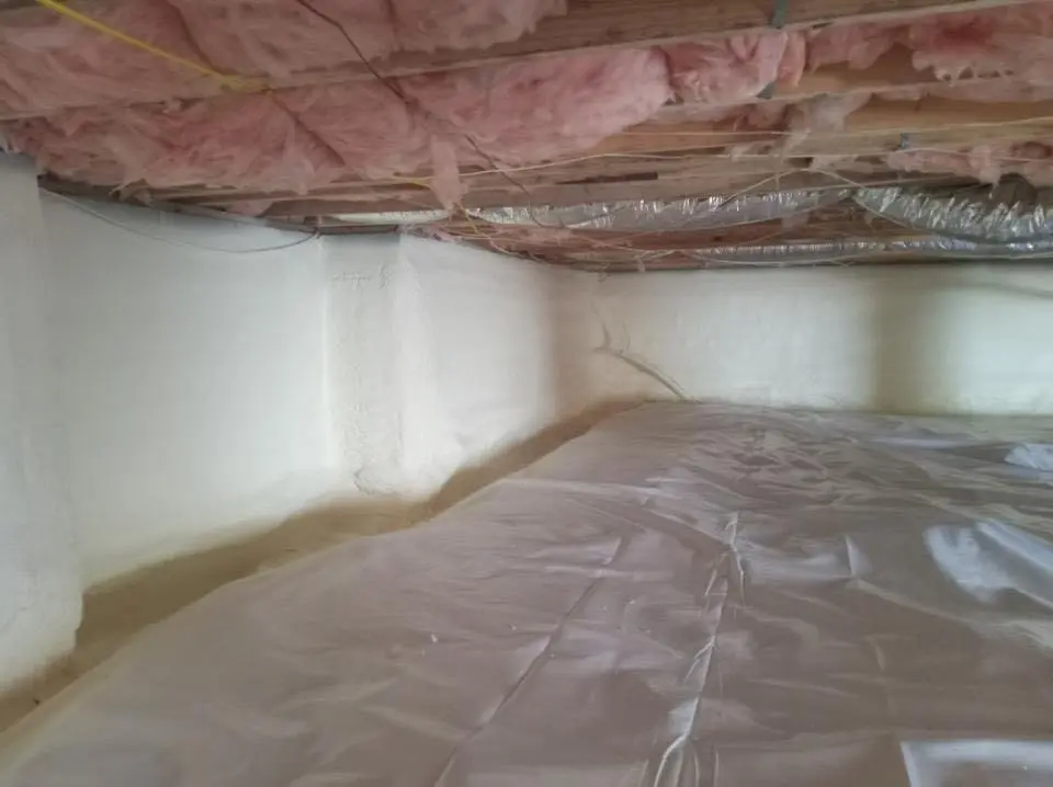 Crawl space encapsulation with closed-cell spray foam for Commercial Roof Restoration in Somerton